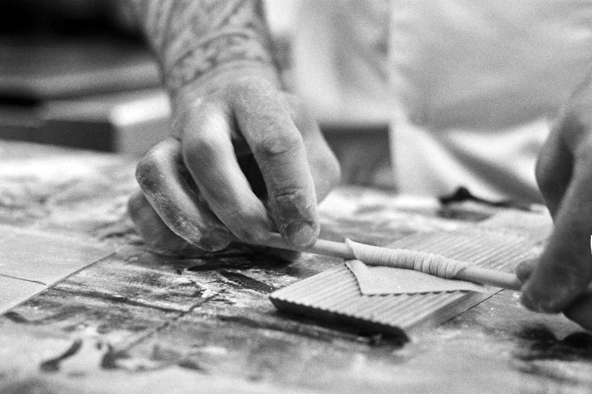A chef at Fletcher's Restaurant Plymouth hand rolling delicate pasta