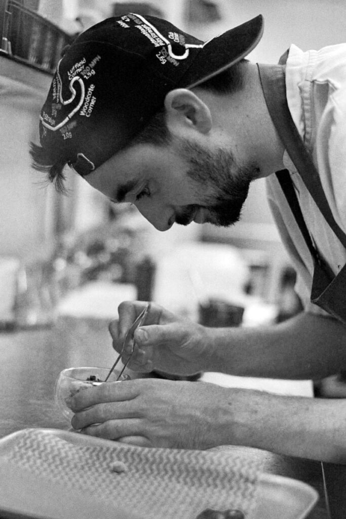 A Fletcher's Restaurant Plymouth chef plates a fine dining dessert.