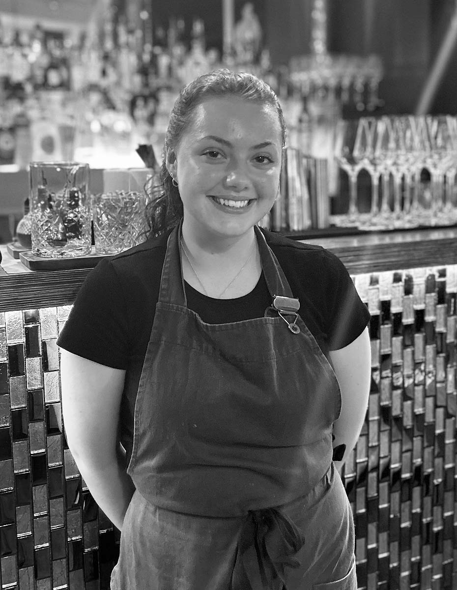 Join the Fletcher's Restaurant Team – A photograph of one of our friendly front-of-house servers, showcasing the welcoming atmosphere and exceptional service at Fletcher's Restaurant.